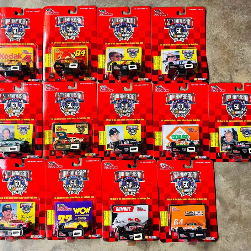 Set of 13 NASCAR 50th anniversary diecast cars in red blister boxes, checkered cards