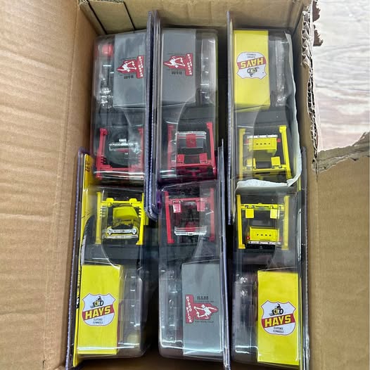 Diecast car collectible set in clear box, with red and yellow vehicles
