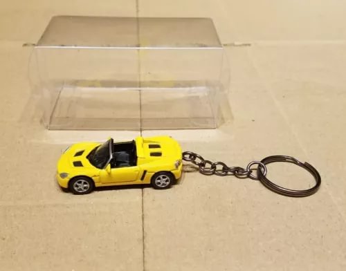 Yellow diecast car keychain with metal chain and black keyring