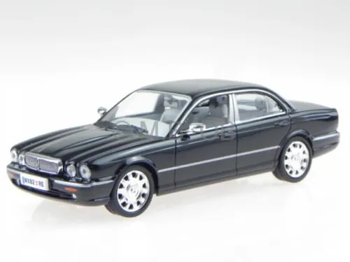 Black diecast model sedan car with chrome grille and front three-quarter view