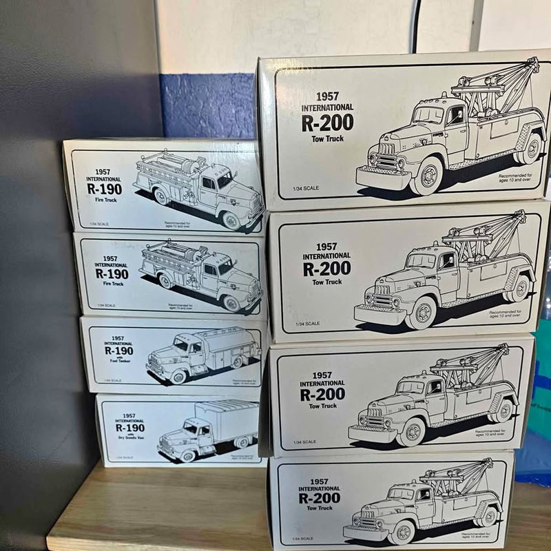 Boxed diecast tow truck models with printed 1957 R-200 and R-190 branding