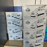 Boxed diecast tow truck models with printed 1957 R-200 and R-190 branding