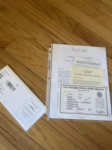 1936 Packard Twelve title paperwork set on white document pages with stamps