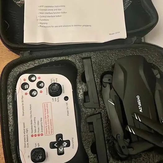 Drone and remote controller kit in black case, controller with buttons and drone body