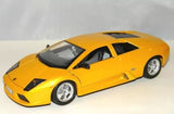 Yellow diecast sports car model with black hood accents and silver wheels