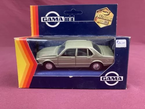 Green 1:43 diecast sedan model in retail box, unpunched card backing