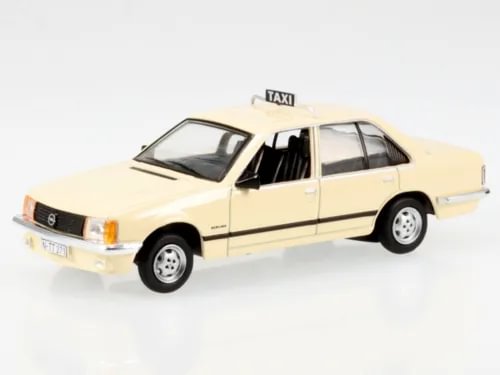 Light ivory diecast taxi model car with roof TAXI sign, front-left view