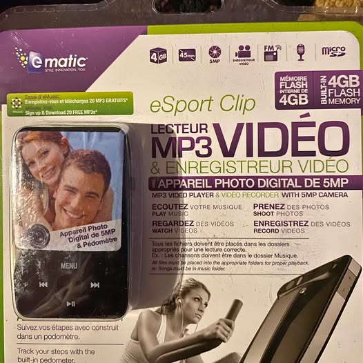 MP3 video player handheld with screen and buttons, in retail box packaging