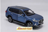 Blue diecast SUV model car with detailed grille and headlights, front 3/4 view