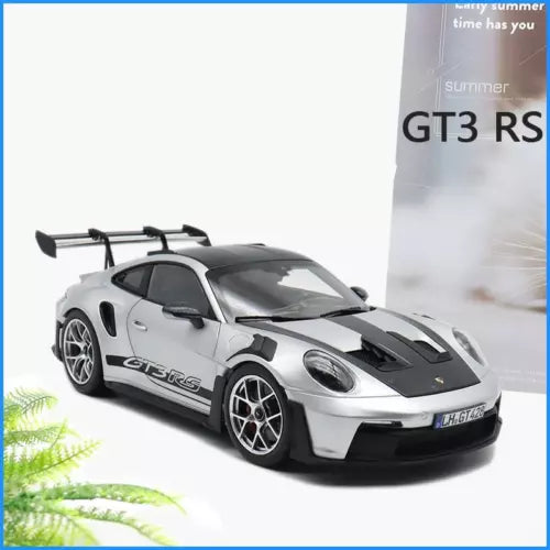 1:36 diecast sports car model in silver with black racing stripes