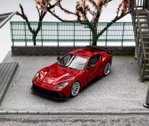 Red sports diecast car model, front 3/4 view