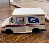 Diecast postal truck toy with USPS LLV logo, white and blue, 1:36 scale