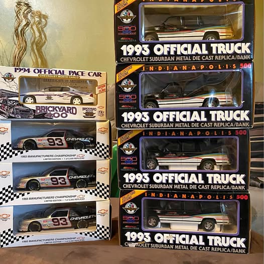 Diecast car model replica boxes with truck and pace car graphics