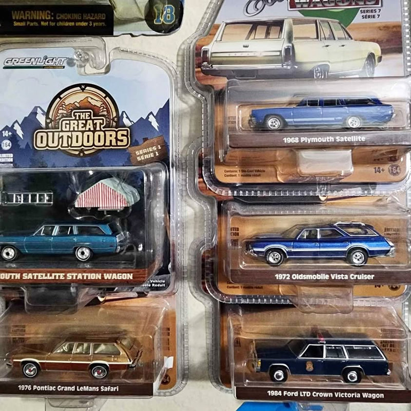 Diecast station wagon toy cars in blister packaging, multiple cars visible