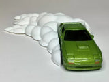 Diecast drift burnout display sculpture with green car and white smoke trail