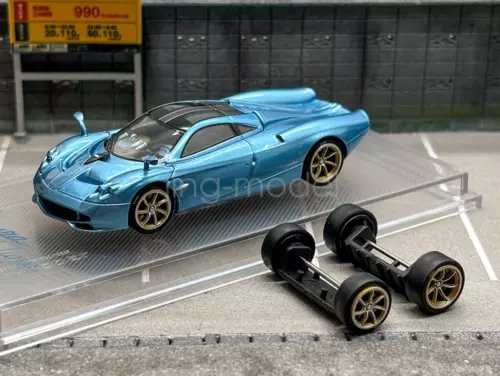 Light blue diecast racing sports model car with clear display stand and black front module