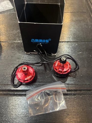 ARRIS drone motor set with two red motors, black leads, and plastic bag