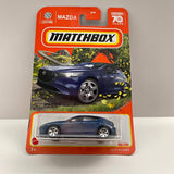 Matchbox 2019 Mazda 3 dark blue diecast in orange retail blister packaging