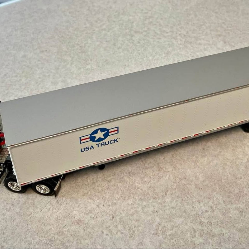 1:64 diecast tractor-trailer replica with USA Truck logo on cream box trailer