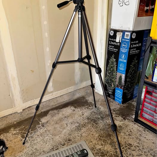 Black three-leg drone tripod stand with adjustable legs