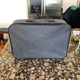 Gray fabric drone carry case with top handle and zipper trim