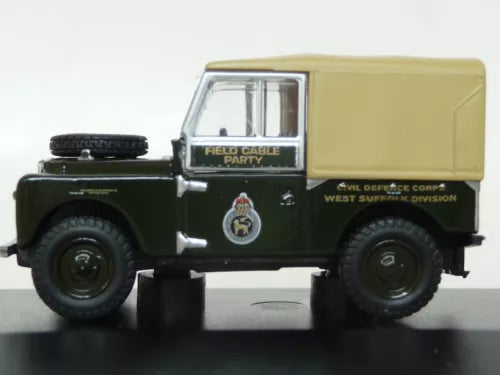 Diecast dark green truck with tan cargo box, field cable label and insignia