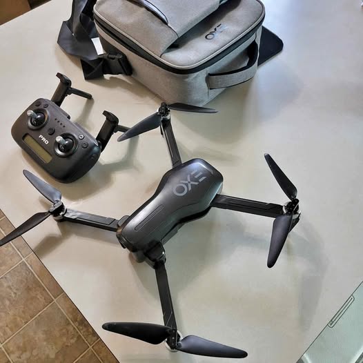 Gray foldable drone set with controller and carrying case