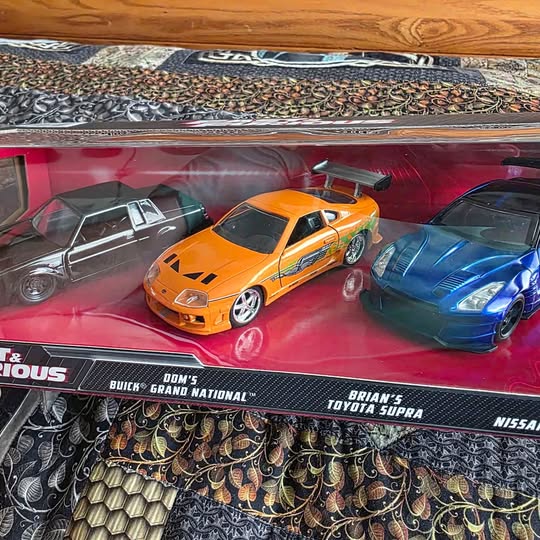 Diecast car set in blister: orange, silver/gray, and blue sports cars