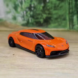 Orange sports diecast model car, front 3/4 view with black wheels
