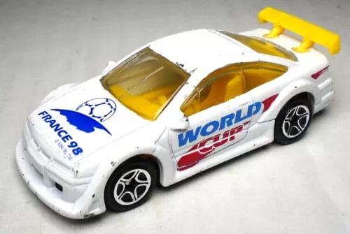 White 1:60 diecast race car with World Cup and France decals, yellow windows