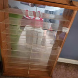 Wooden car display shelf with 24-slot open grid for diecast cars