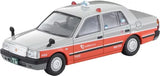 Diecast taxi sedan model car in white with orange side stripes