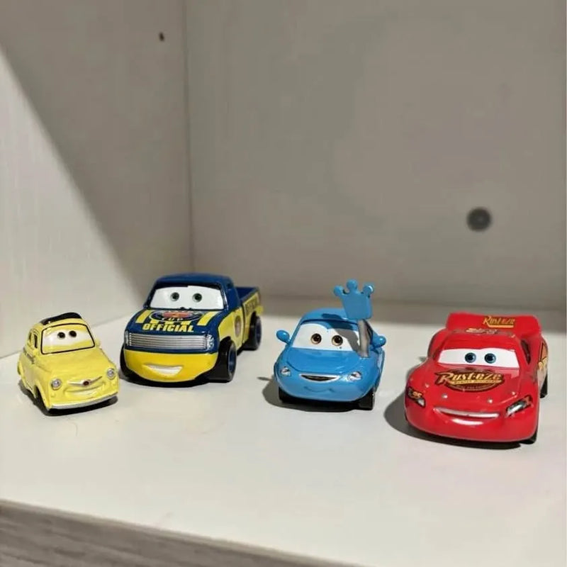 Disney Pixar diecast race car set with yellow, blue, and red cars on display
