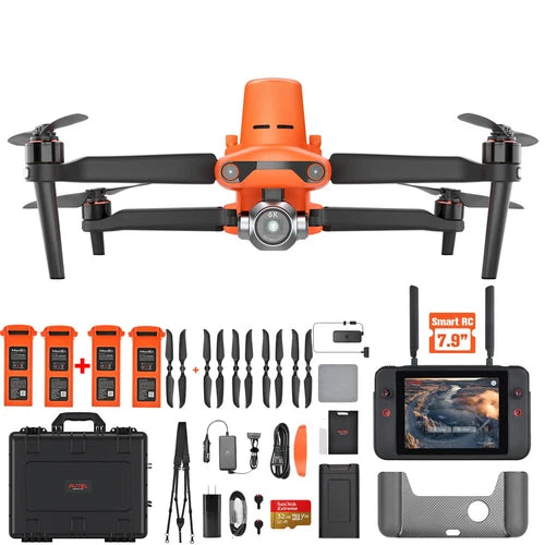 Orange quadcopter drone kit with remote controller, monitor, batteries, propellers, case