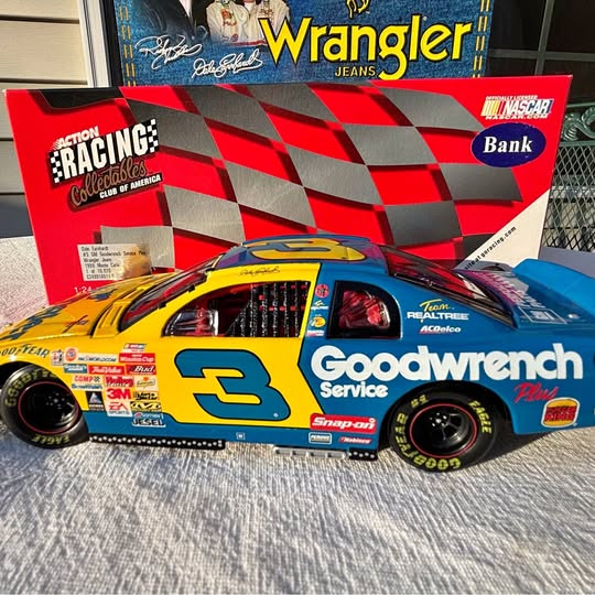 NASCAR diecast race car with yellow and blue body, black wheels, number 3