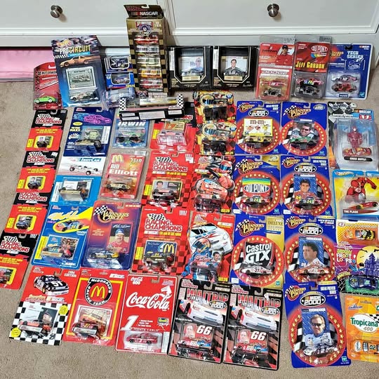 NASCAR diecast collectible lot with many boxed cars and blister-pack items