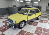 1/24 scale diecast model car, yellow with black bumper and wheels