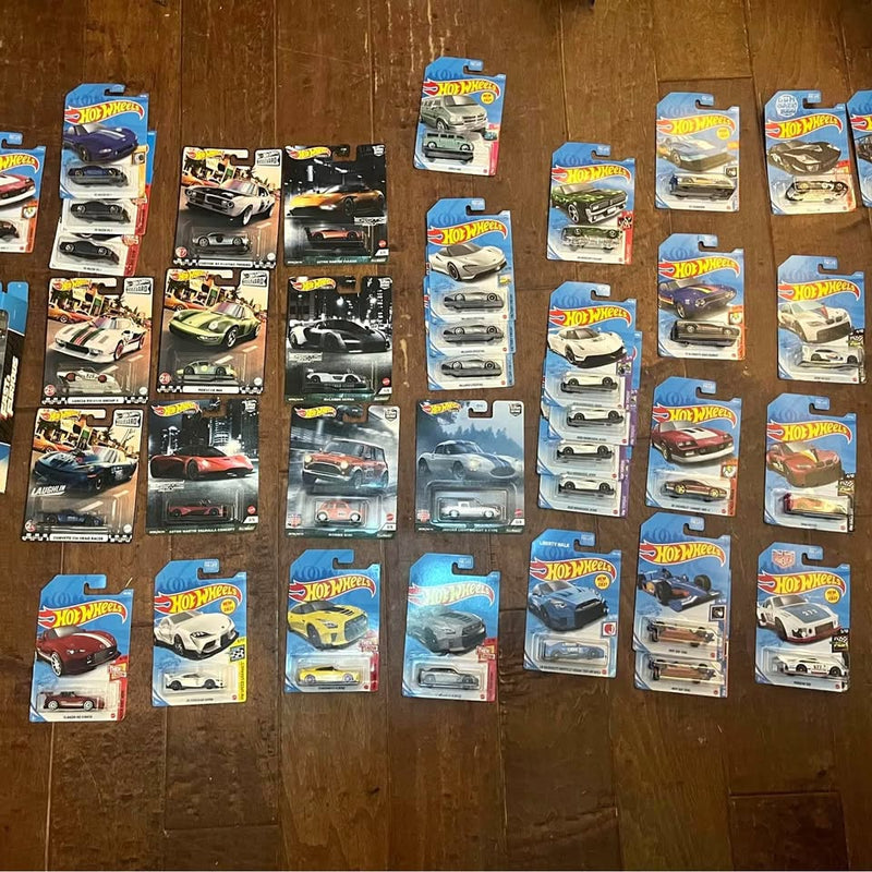 Collectible diecast car set in blister packaging, multiple models