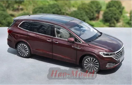 Burgundy 1:18 diecast car model, side view with alloy wheels