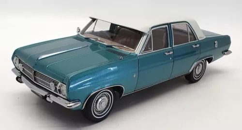 Turquoise diecast model sedan, front three-quarter view, detailed grille and chrome bumper