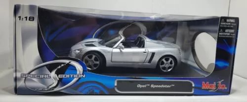 1:18 scale diecast convertible sports car model in retail box, silver with blue accents