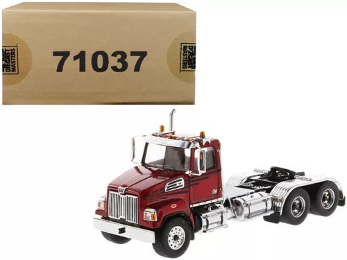 Red diecast day cab tractor model truck with chrome grille and front bumper