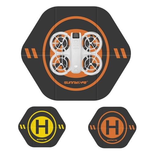 Weighted drone landing pad with orange ring design and hexagonal shape