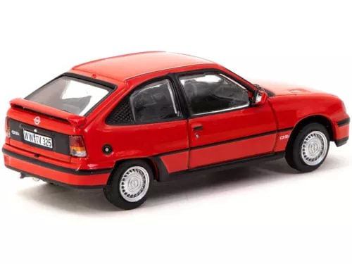 Red diecast Opel Kadett GSi model car, side view with black wheels and windows
