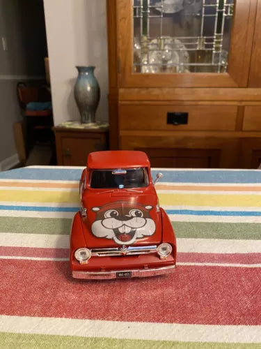 Red diecast Ford pickup truck model with Buc-ees face decal, 1/24 scale.