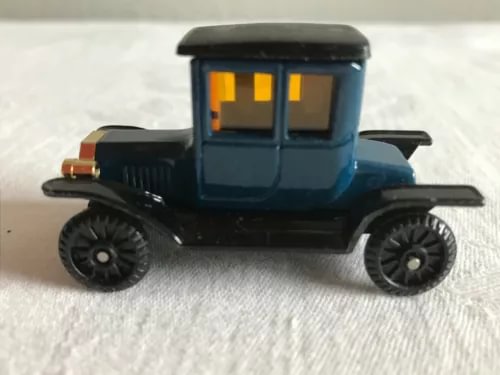 Blue and black diecast coupe roadster toy car with open windows
