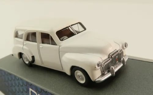 White 1:64 diecast station wagon panel van model with front grille and side view