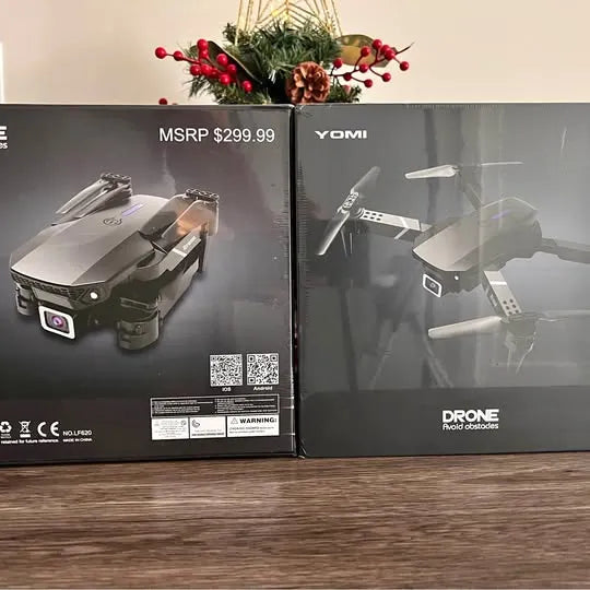 YOMI drone retail box with images of a foldable quadcopter