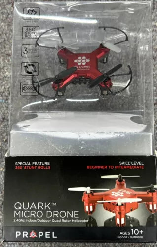 Red micro quadcopter drone with propellers, packaged for indoor/outdoor use