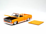 Orange 1973 pickup diecast model car, open hood, 1:64 scale collectible